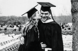 Mary Carpenter ’97 kisses Andy Hasselwander ’97 on the cheek at commencement