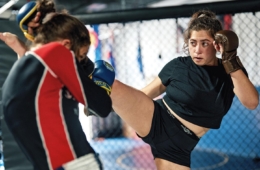 Kassandra Alberico ’17 kicks opponent during mixed martial art practice