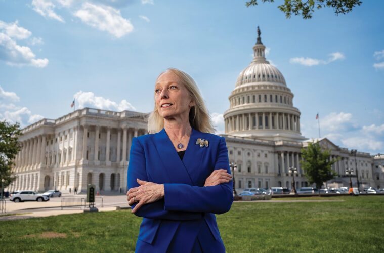Mary Scanlon stands in front of the Capitol Building