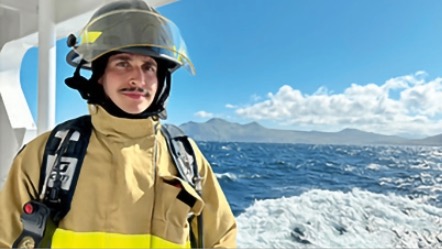 Rob Sobelsohn ’19 dressed in full gear aboard a ship with the ocean and open sky in the background