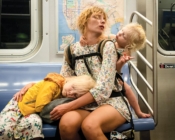 A woman on the subway wit her two children