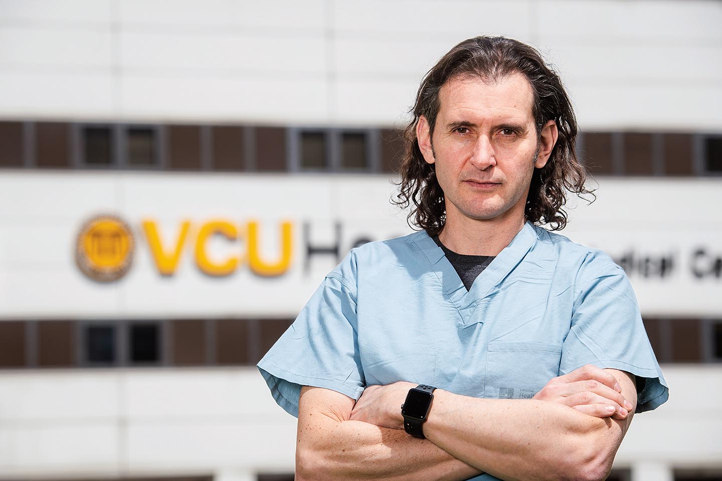 Dr. Gonzalo Bearman stands in front of VCU building