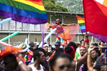 Michael Francis James '17, with the help of his stilts, floats above the crowd at Trinidad and Tobago's first public Pride Arts Festival