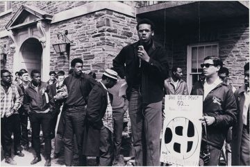 Bill Robinson, Class of 1969, speaks during rally, 1968