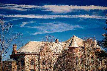 Blue sky over James B. Colgate Hall roofline