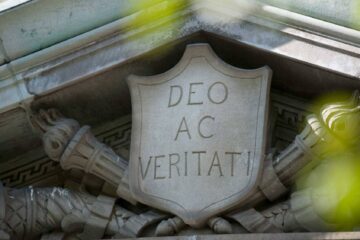 "Deo Ac Veritati," Colgate's motto inscribed in a stone shield. Part of an architectural detail on a Colgate building.