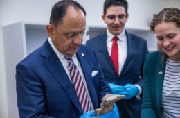 Consul General López and Co-Director of University Museums Rebecca Mendelsohn examine an artifact from the University's collections.