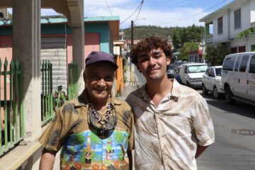 Jorge Rochet stands with Teofilo "Fily" Bermudez on a street in Puerto Rico