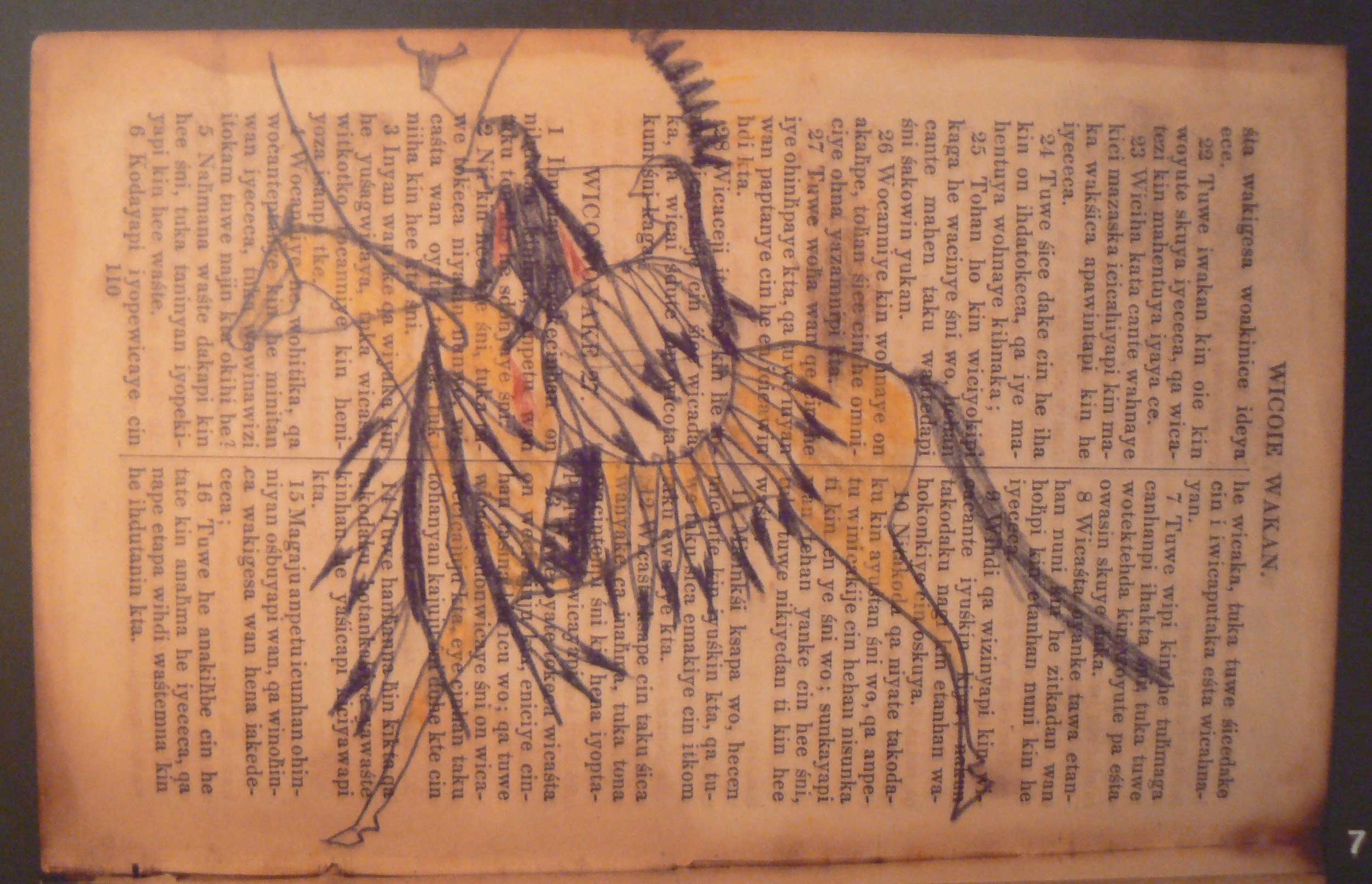 Bible translated into Dakota with drawing of Native American over text