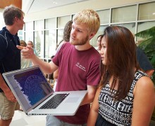 Students look at content on a laptop in Colgate's Ho Science Center