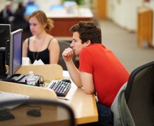 Student concentrating while working at a computer