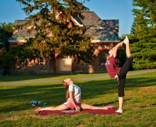 Students practicing yoga on the academic quad