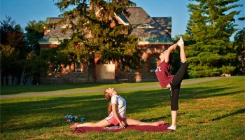Students practicing yoga on the academic quad