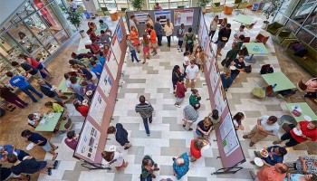 View of poster session from above in the atrium of the Ho Science Center