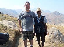 Gary Martenson ’95 in Madagascar’s Andringitra National Park with a porter.
