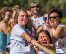 First-year students smile and strain during a tug of war competition