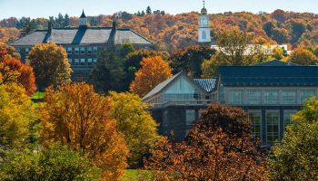 The Colgate University campus from a distance amidst autumn foliage
