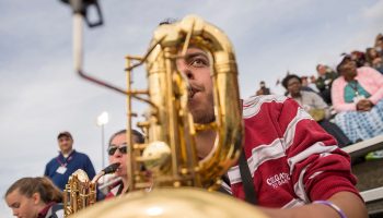 Ryan Rios '20 playing saxophone during football game
