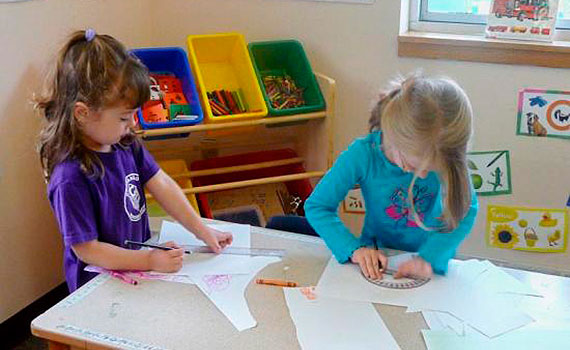 Children of the Chenango Nursery School working on a craft at a table