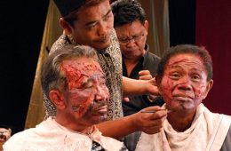 Two of the murderers featured in The Act of Killing, Adi Zulkadry (left) and Anwar Congo (right), have makeup applied for their scenes.