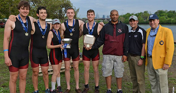 Colgate Varsity 4+ crew and coaches proudly display their hardware from the program's first Dad Vail gold medal.