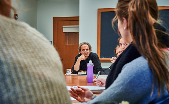 Students in class with Colgate professor Peter Balakian