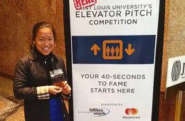 Miranda Scott ’18 stands by a poster at the “Real” Elevator Pitch competition in St. Louis, Mo.