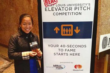 Miranda Scott ’18 stands by a poster at the “Real” Elevator Pitch competition in St. Louis, Mo.