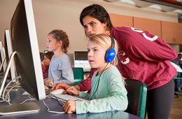 Colgate Women in Computer Science students help teach coding to local elementary school students.