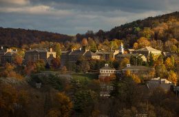 A scenic view of Colgate's campus and hillside from a distant with dramatic lighting