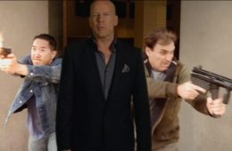 Stuntman Grant Koo ’93 (left) in the movie Vice. Bruce Willis (center) comes out in the opening scene, stops the footage, and explains the premise of the movie.