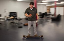 Harry Raymond, founder of an on-line app to explore beers, wines and spirits, skateboards through the Colgate University Thought Into Action Incubator, located on Utica Street in downtown Hamilton, NY.