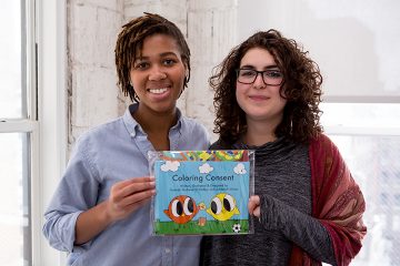 ehdeiah Mixon ’18 and Hannah Shaheen O’Malley ’17 hold up a publication they produced for their new startup, UNRAVEL