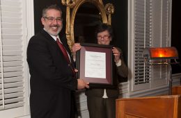 Professor Frank Frey and Interim Provost and Dean of the Faculty Constance Harsh hold Balmuth Award