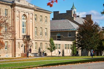 Students walk along the Colgate Academic Quad during the fall.