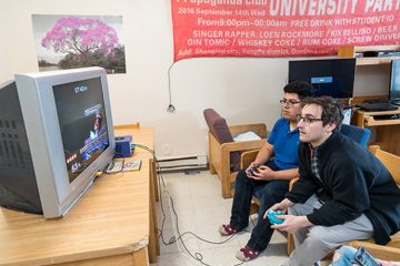 Two Colgate students play a video game