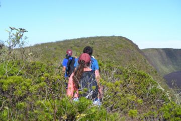 Students hike Sierra Negra, a volcano, to capture footage in the Galapagos Islands.
