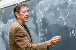 Chemistry professor Ernie Nolen at the chalkboard