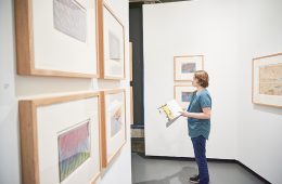 Student views artworks in the Picker Art Gallery
