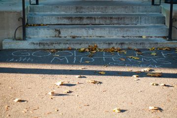 "Good luck with midterms" chalked on steps of academic building by DoRAK members